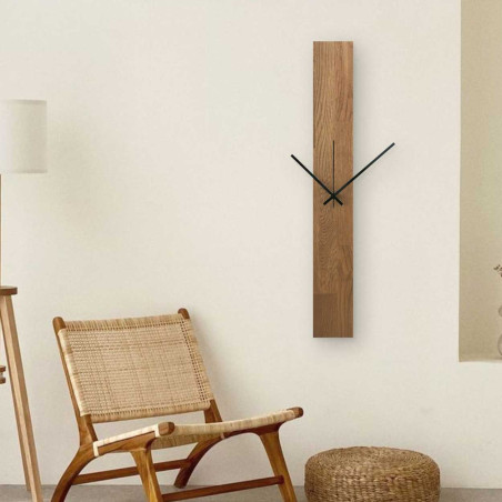 Vertical wooden clock with combined black and silver hands without numbers. Vertical wooden clock with combined black and silver hands without numbers.