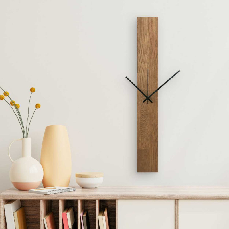 Wall clock with a narrow wooden panel and hands in black and silver.