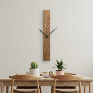 A clock made of natural wood with a distinctive pattern and contrasting silver and black hands. 2