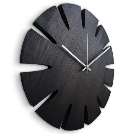 Large wall clock made of solid wood with a subtle minimalist look. Large wall clock made of solid wood with a subtle minimalist look.