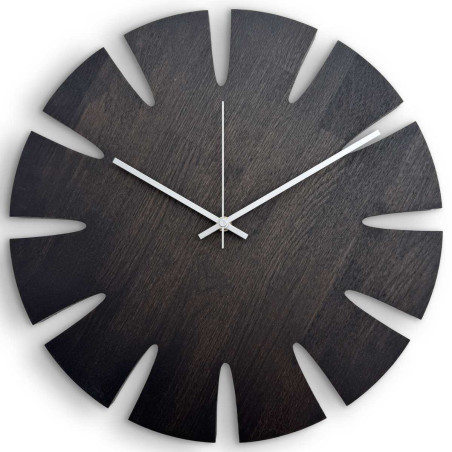 Elegant carved wooden wall clock with an original design suitable for the kitchen. Elegant carved wooden wall clock with an original design suitable for the kitchen.