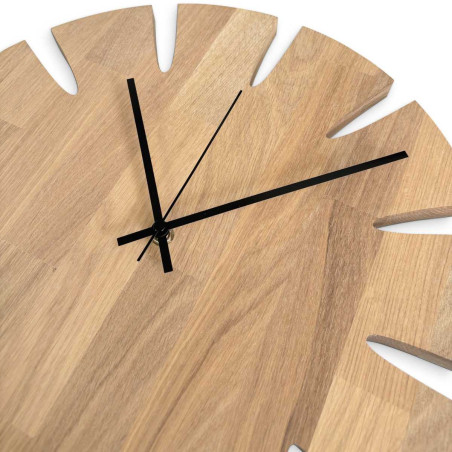 Elegant wall clock made of solid wood as an addition to a modern living room.