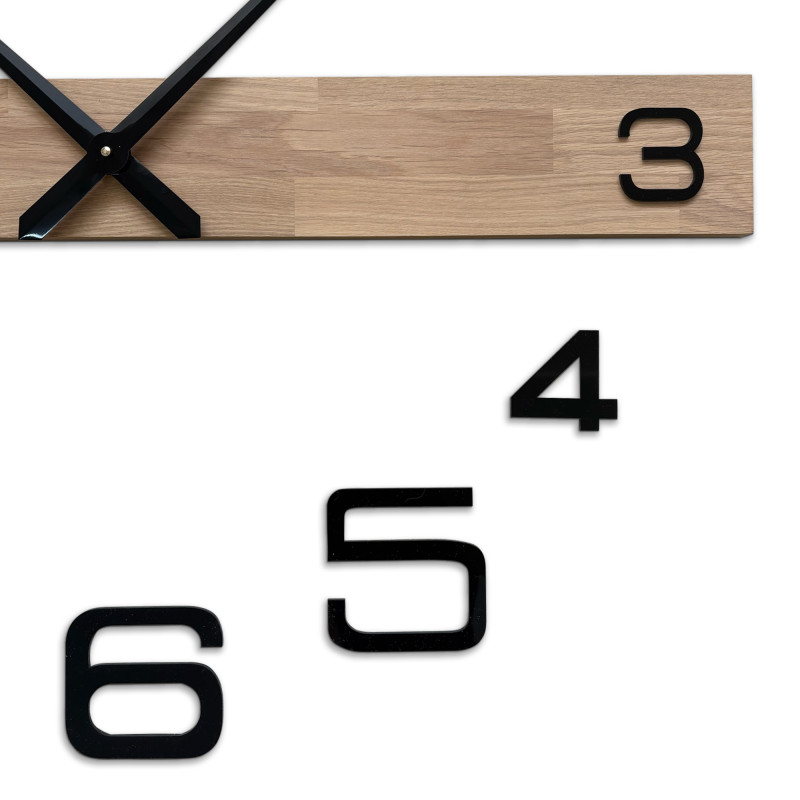Wooden kitchen clock with a clean and elegant look suitable for modern spaces.