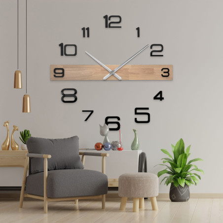 Modern wooden wall clock with large black numbers and elegant hands.