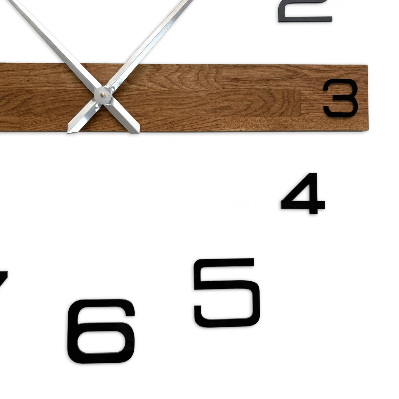 Wooden clock with a minimalist design and black, easy-to-read numbers.