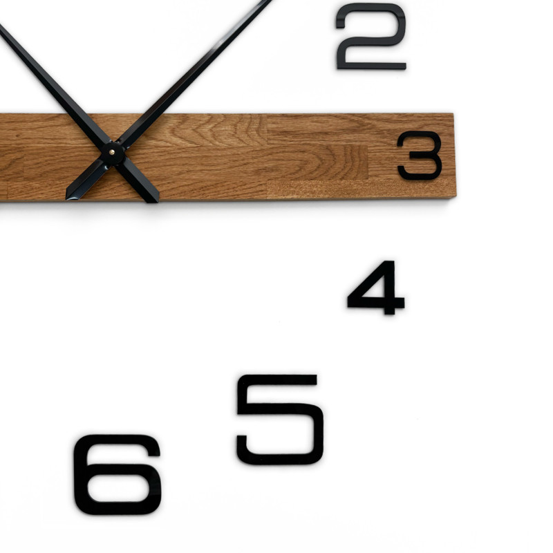 Large wall clock with wooden detail and black plastic numerals, also suitable as a cheap solution.