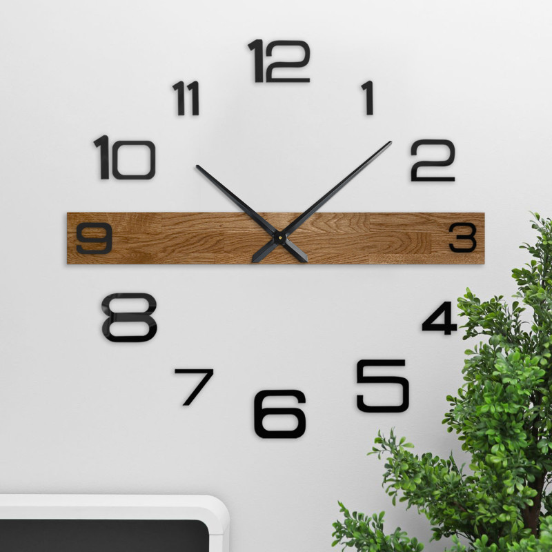 Large wooden wall clock with black Arabic numerals and dark hands, suitable for the living room.