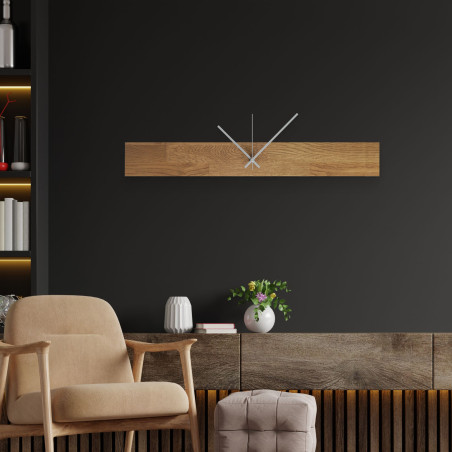 Large wooden wall clock with distinctive black hands and separate numbers.