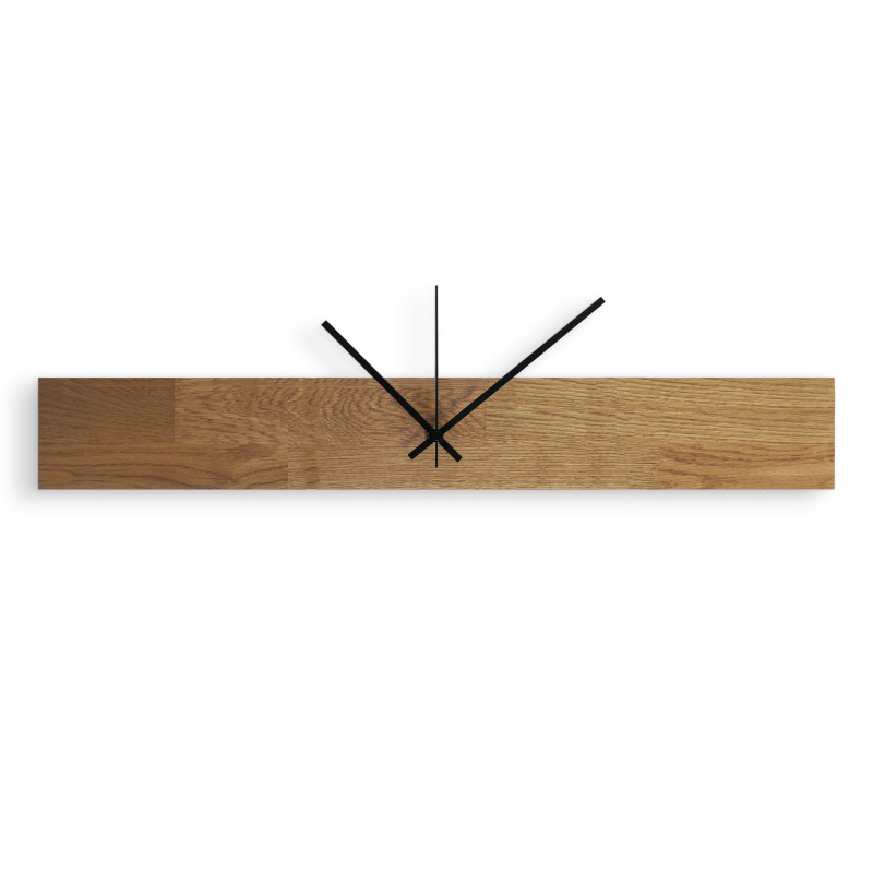 Modern and inexpensive wooden clock with dark hands and black separate digits.