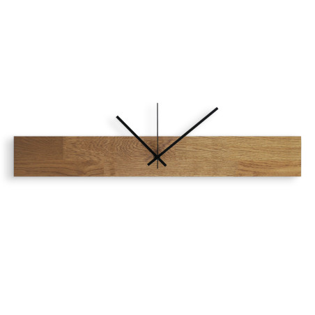 Modern and inexpensive wooden clock with dark hands and black separate digits.
