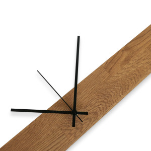 Modern and inexpensive wooden clock with dark hands and black separate digits. 2