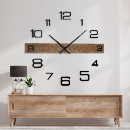 Modern wall clock with a wooden center bar and black, separate digits.