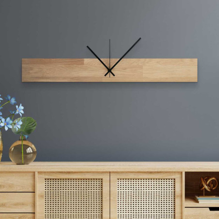 Wooden wall clock with a narrow rectangular shape and black hands