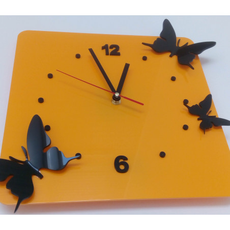 Modern wall clock made of plexiglass. Trendy clock on the wall as a gift. X-momo clocks. PMMA