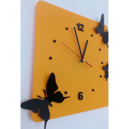 Modern wall clock made of plexiglass. Trendy clock on the wall as a gift. X-momo clocks. PMMA