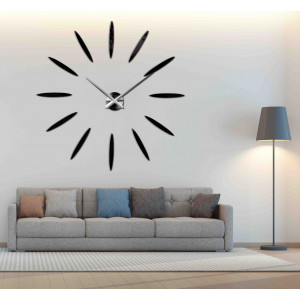Wall clock with large gold indexes and silver hands, glued directly to the wall 2