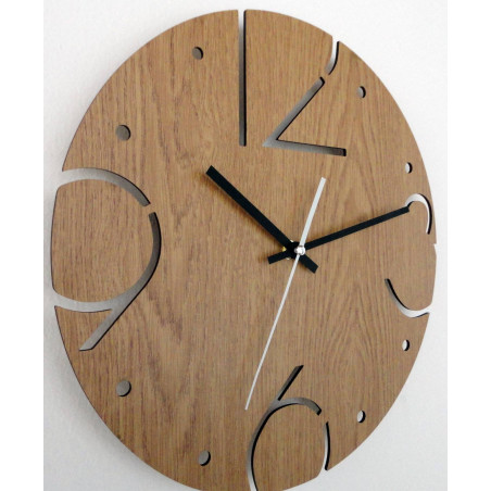 Elegant HDF clock with carved numerals and a wooden surface in oak decor. Elegant HDF clock with carved numerals and a wooden surface in oak decor.