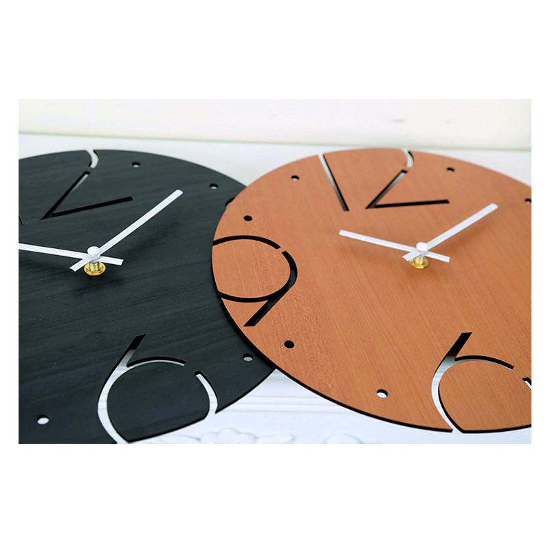 A clock made of solid material with a smooth surface and contrasting arrangement of elements.