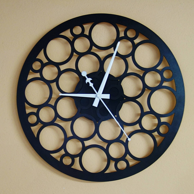 Wall clock made of wood plywood in the footsteps of time