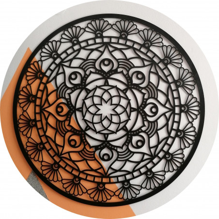 The mandala of life is rounded by a wooden picture on a wall made of SUSEN
