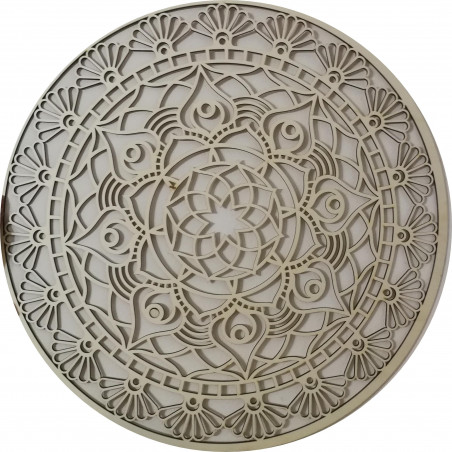 The mandala of life is rounded by a wooden picture on a wall made of SUSEN